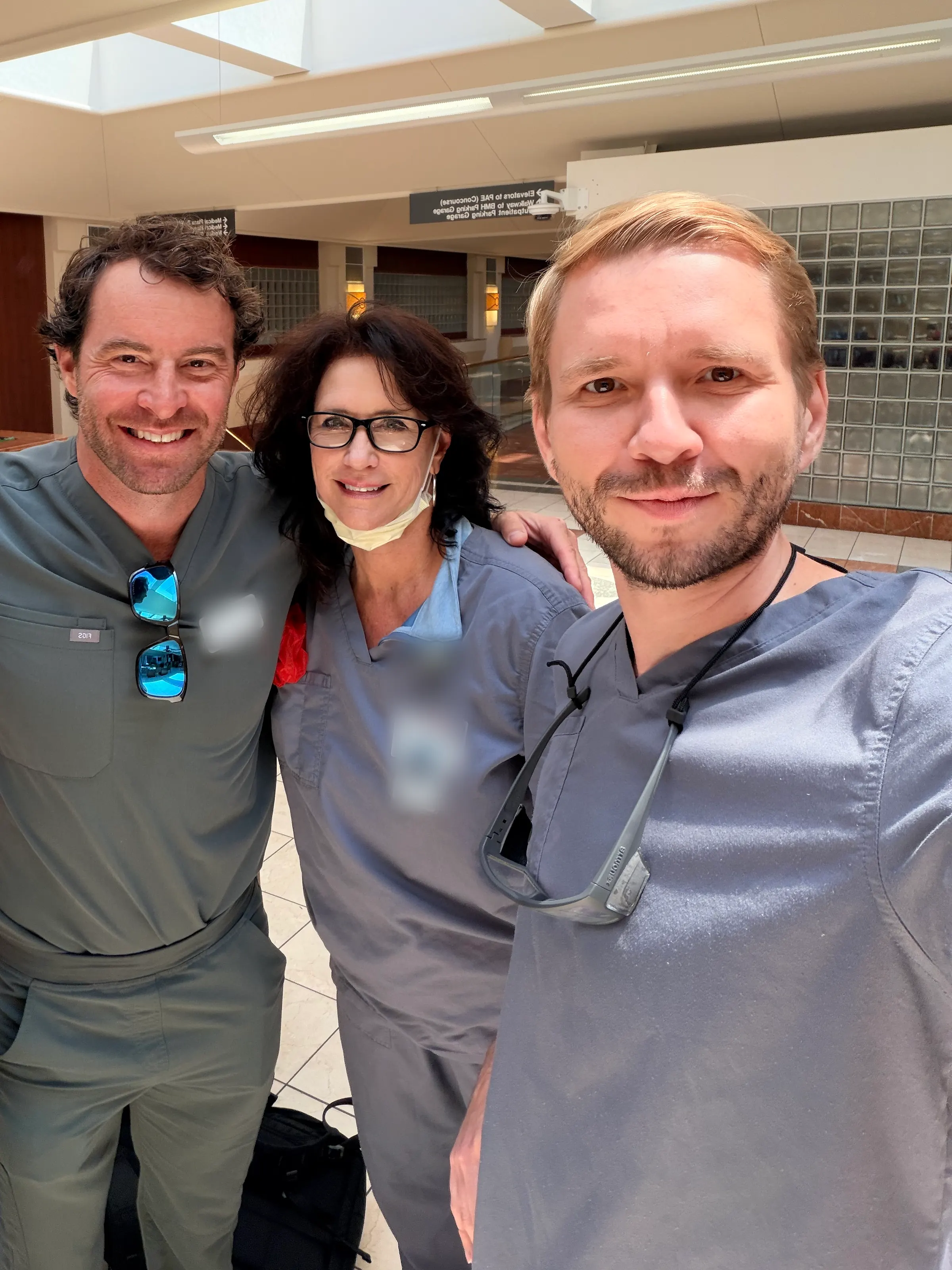 Dr. Yaranov and two colleagues in scrubs, smiling together